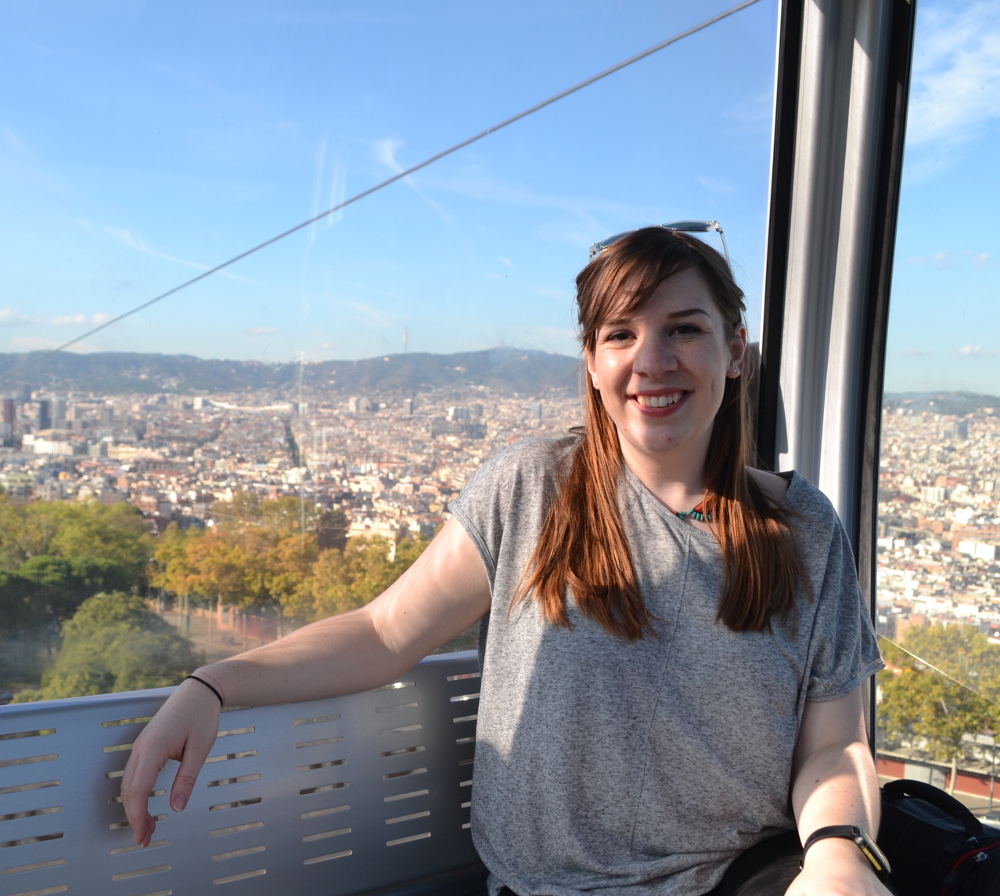 Image of Sarah sitting in cable car in Barcelona